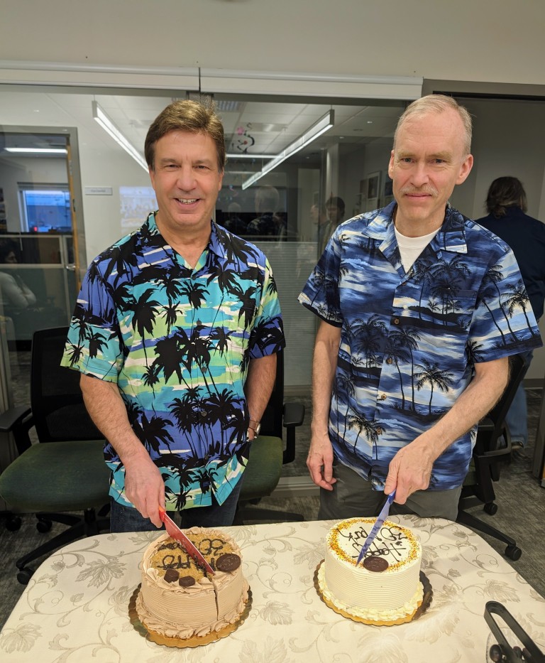 Dave and Mark Langberg cutting cakes