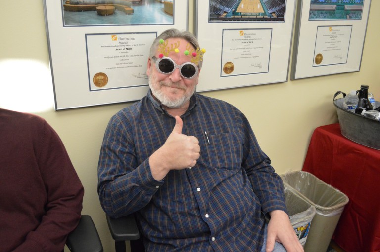 Keith wearing festive glasses at a company event