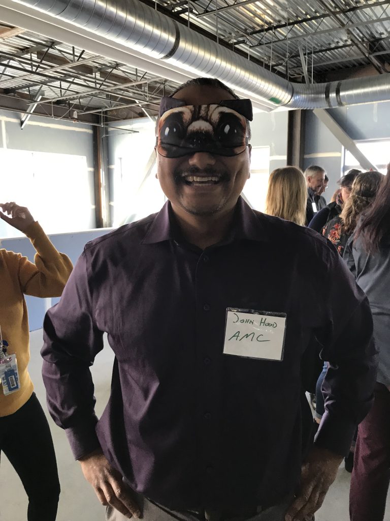 John in an eye mask with dog eyes on it