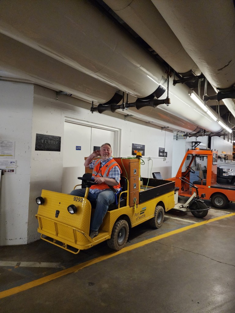 AMC employee in small cart in Seattle