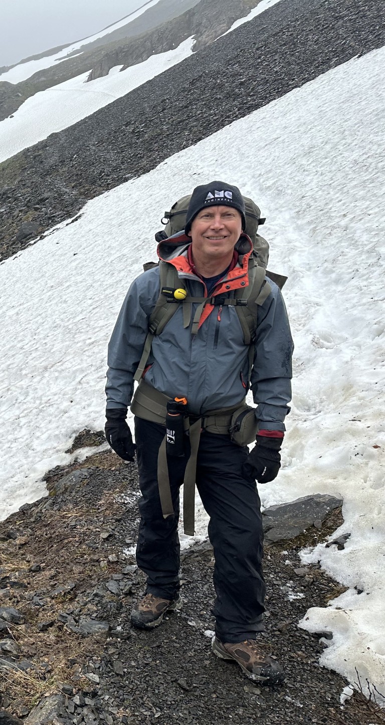 Ken hiking on a snowy mountain