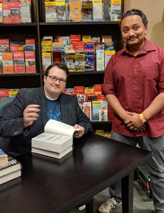 John getting a book signed at a book signing