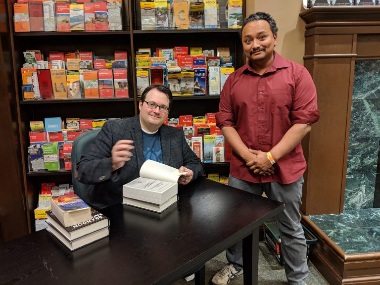 John getting a book signed at a book signing