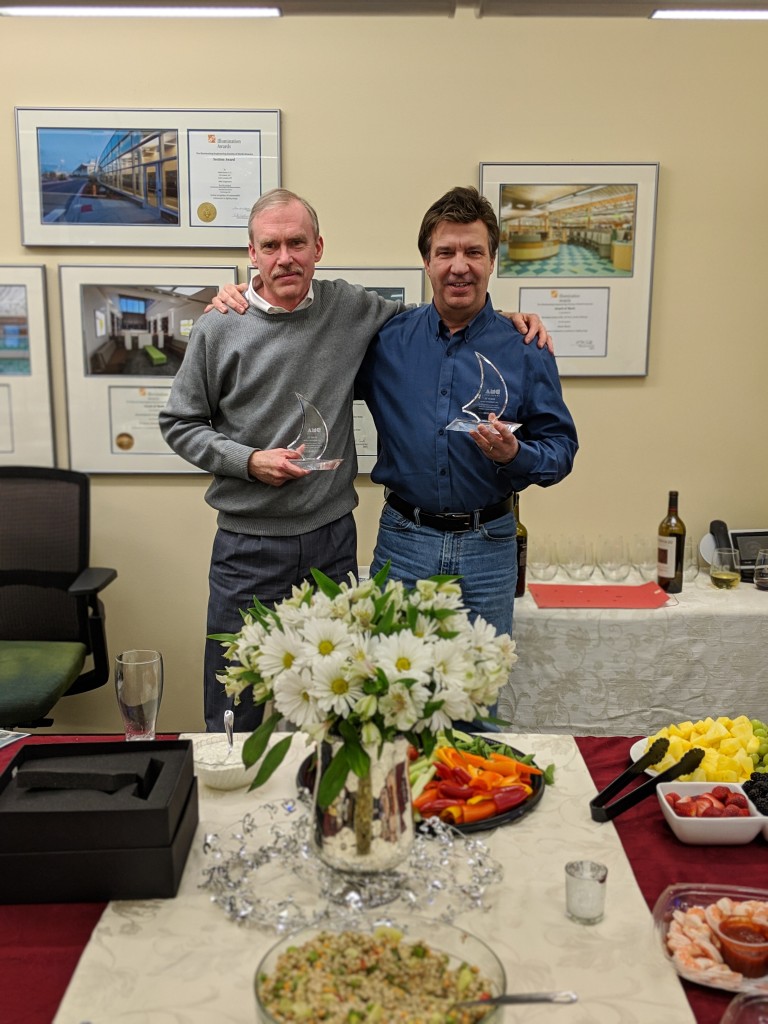 Mark and Dave Shumway holding small trophies