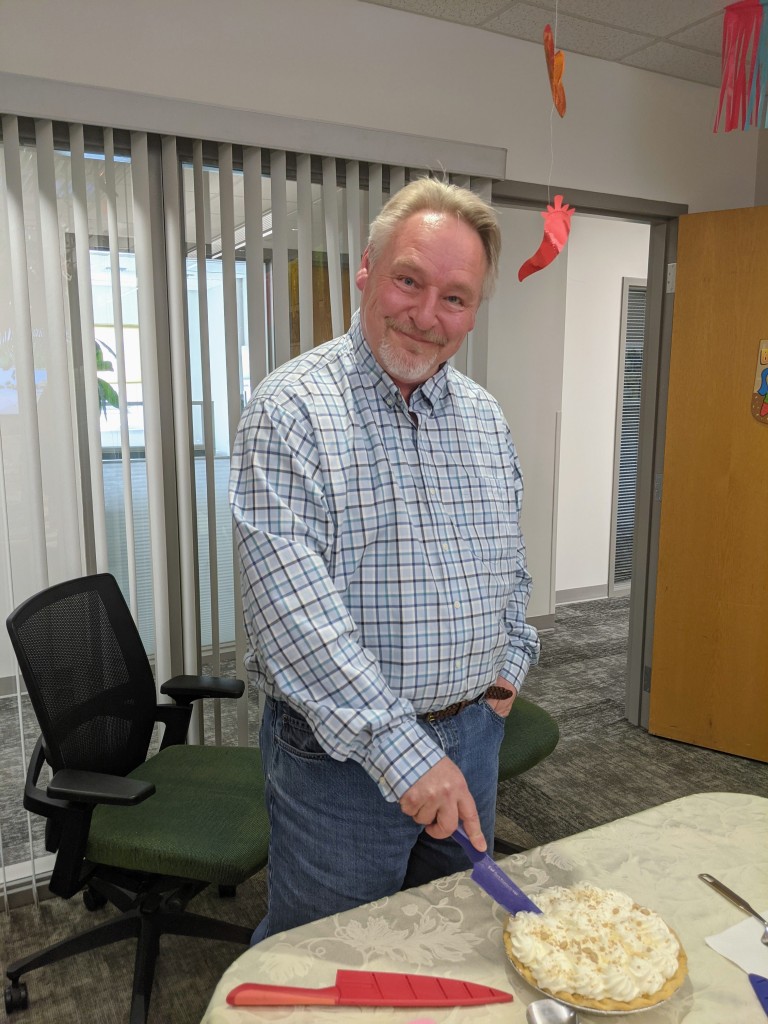 Keith cutting a pie