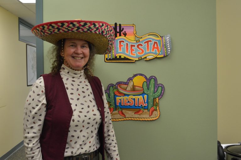 Tami wearing a sombrero in an office