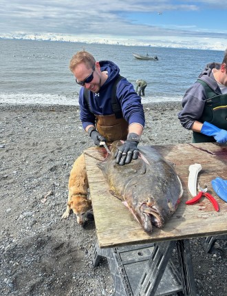 Bart cutting a large fish