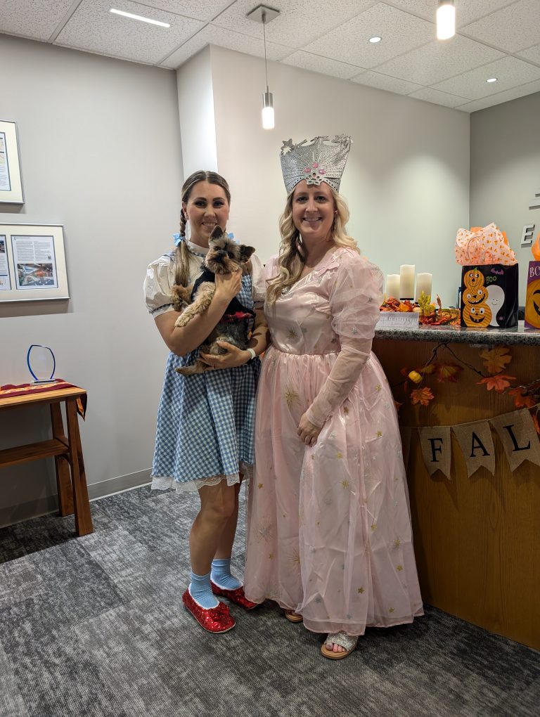 Michelle and other AMC employee in Wizard of Oz halloween costumes