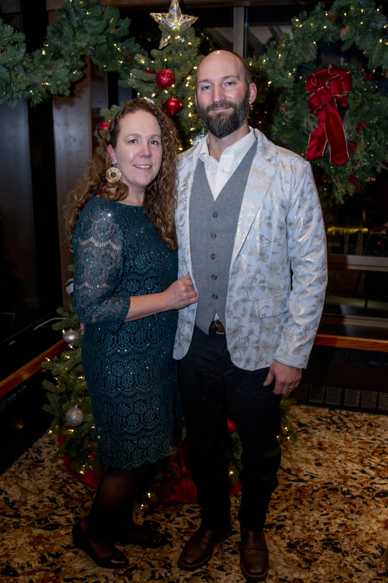 Cory Crawford with a woman at a Christmas party