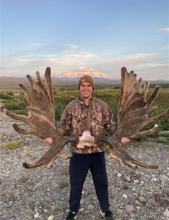 Carson holding large antlers