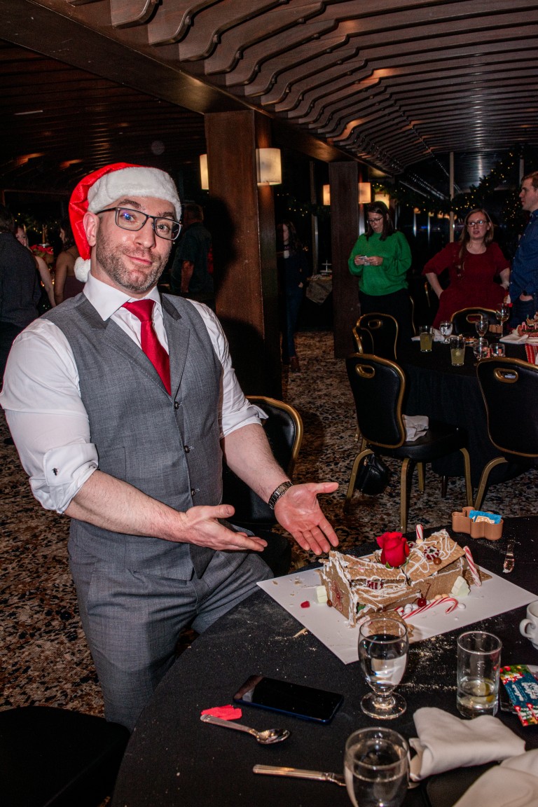 David pointing at a collapsed ginger bread house