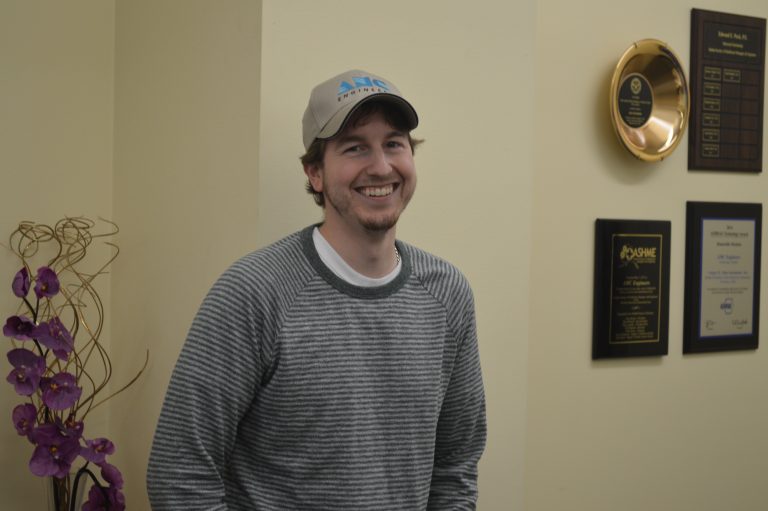 Christian smiling in an AMC hat