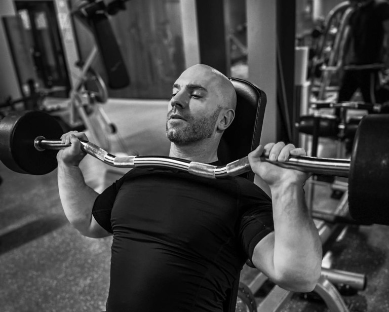 David lifting weights on a bench press