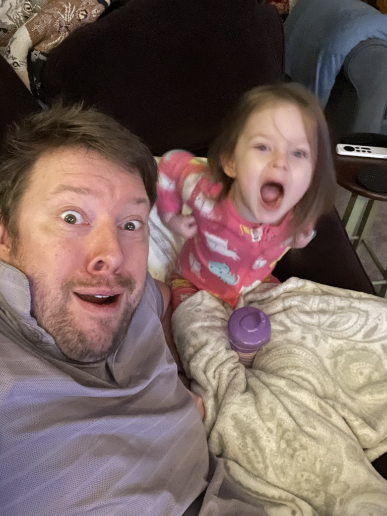 Tylter Tremont looking surprised with a young girl