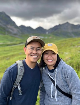 Marlon Lontoc with woman posed in front of mountains