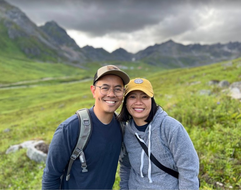 Marlon Lontoc with woman posed in front of mountains