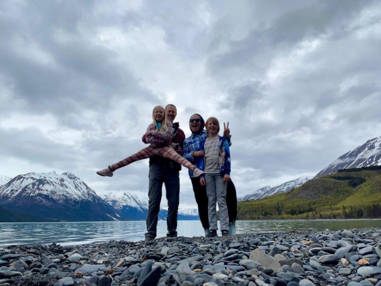 Matt and woman posing with two children