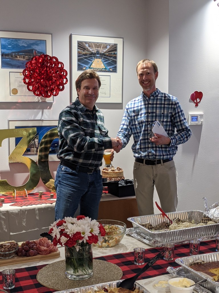 Matt shaking hands with Dave Shumway