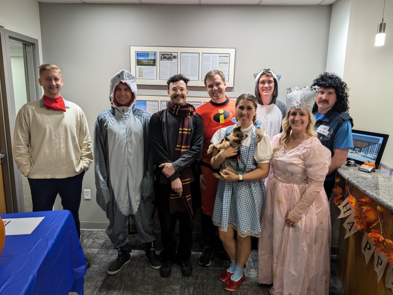 Multiple AMC employees in halloween costumes
