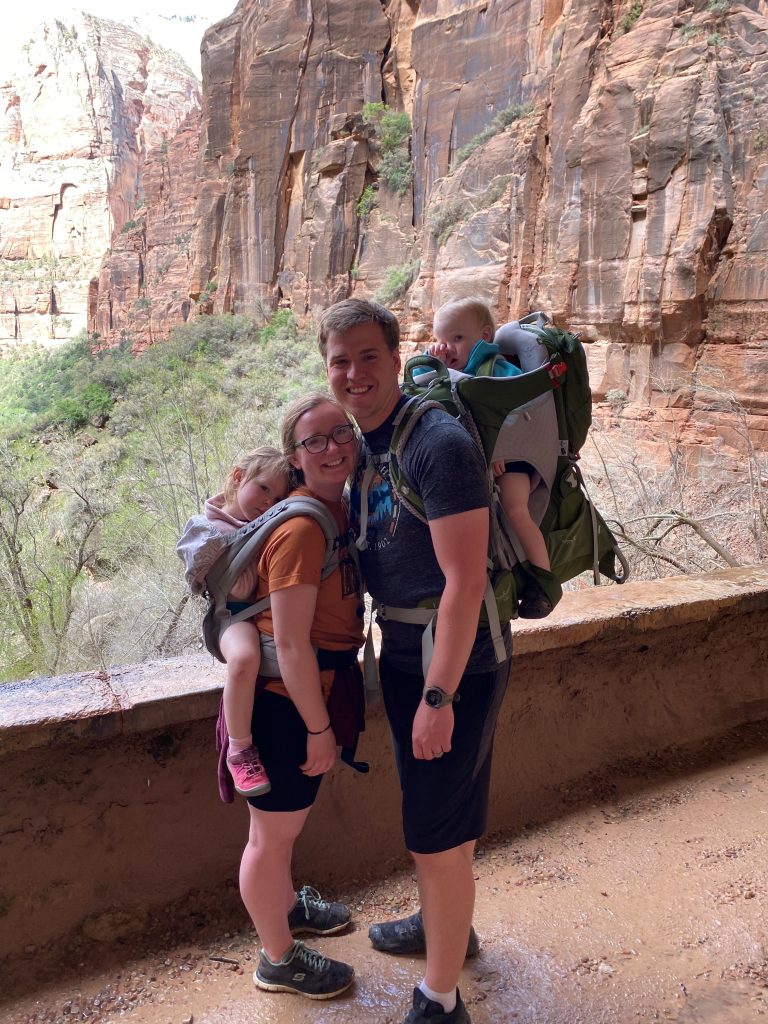Trenton hiking a mountainscape with a woman and two children