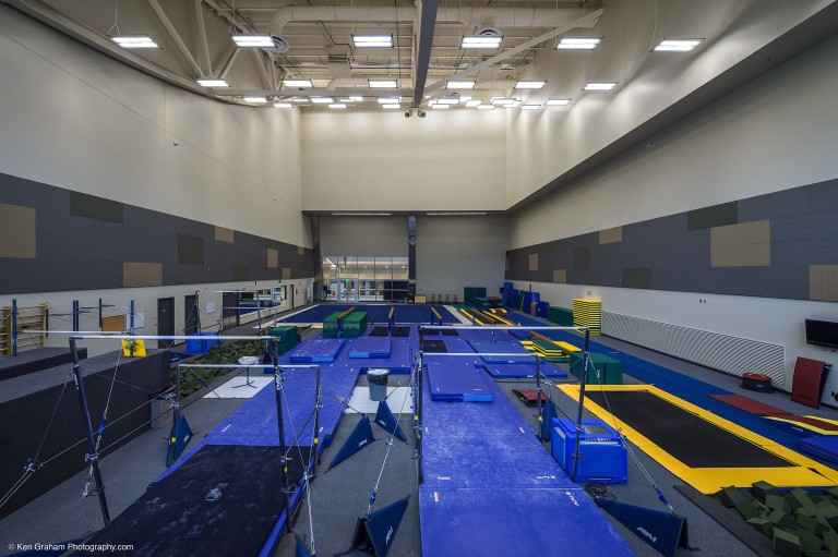 Gymnast equipment in large brightly lit room