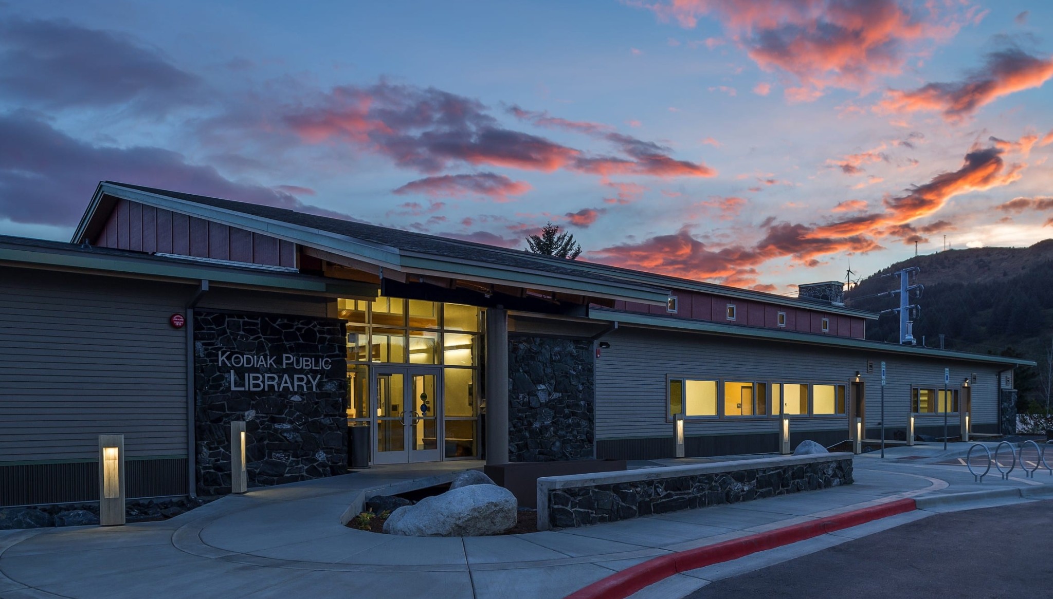 One story building with stone and paneled walls