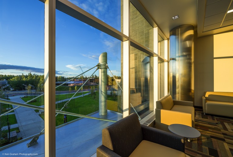 Window looking out to lit pathways