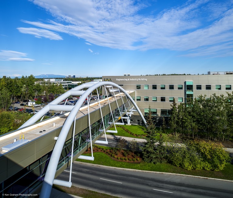 Passenger bridge connecting two buildings over a road