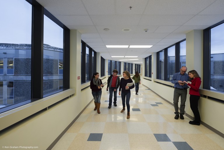 Kids walking down the hall of a high school