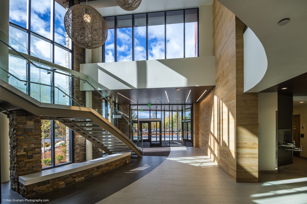 Large decorative lighting hanging from high ceiling in entryway