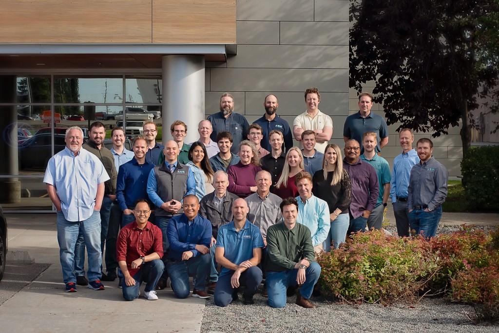 AMC Engineers team posing outside office building