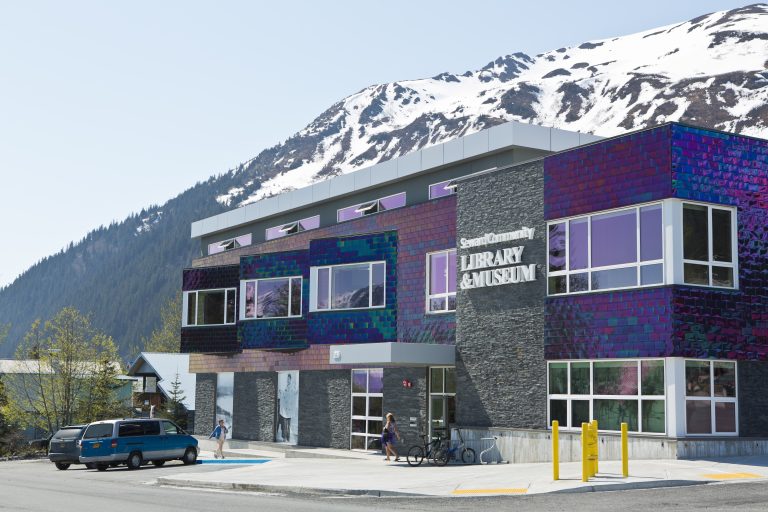 Iridescent tiled and stone brick exterior of multistory building