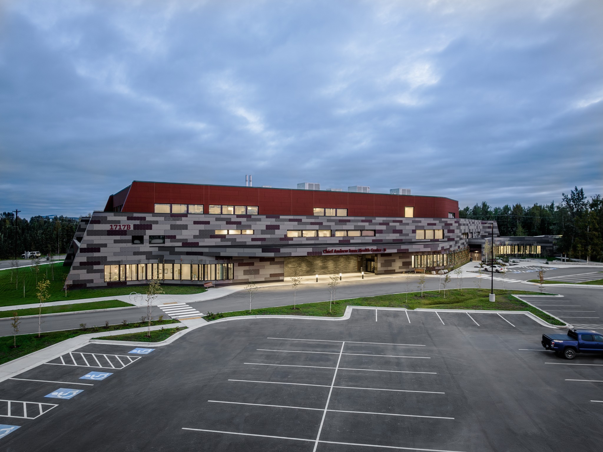 Exterior of multistory building with red and gray colorful tile walls