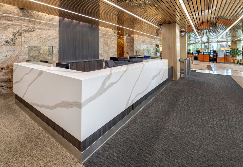 Brightly lit decadent marble receptionist desk