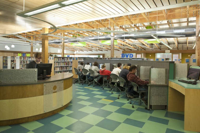 Interior of library receptionist desk and computer tables