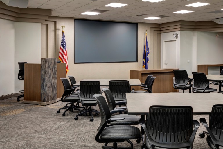 Meeting room with multiple tables and projector