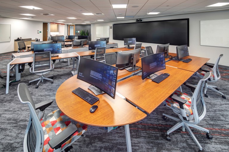 Computer room with wall full of TVs