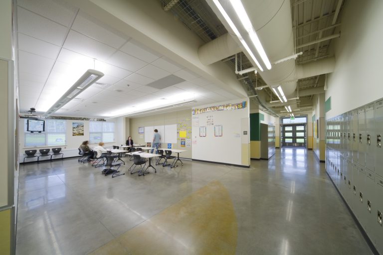 Decorative lighting in school hallway and open classroom