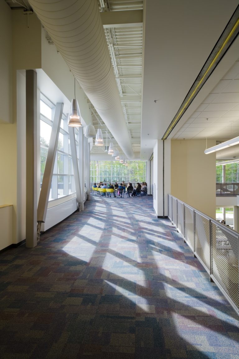 Decorative chandeliers along school hallways