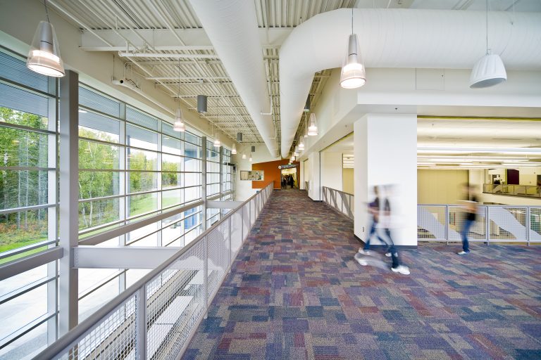 Decorative chandeliers along school hallways