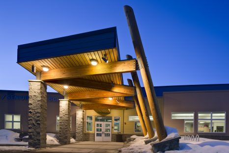 Decorative lighting in covered entryway to school