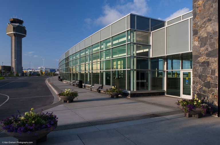 Road, air control tower and exterior of airport