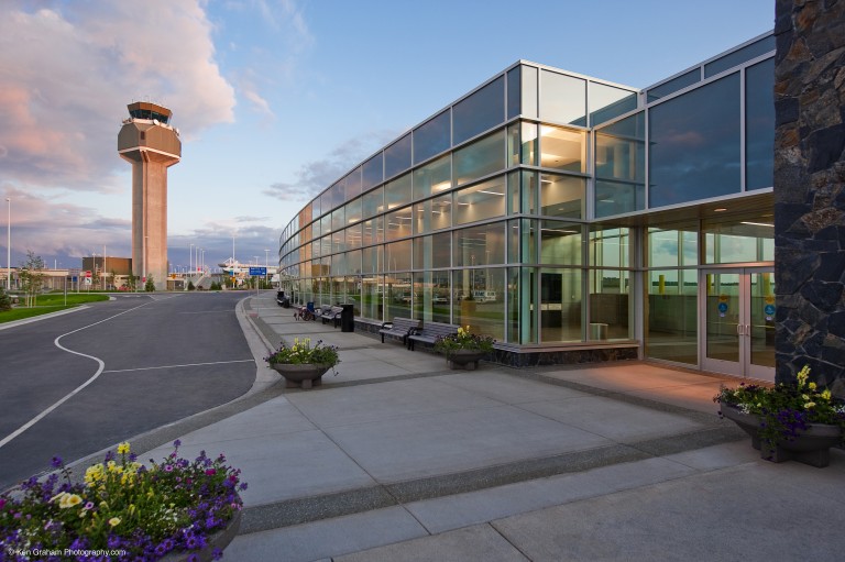 Road, air traffic control tower and exterior of airport