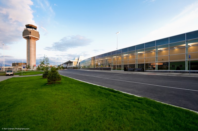 Road, air traffic control tower and exterior of airport