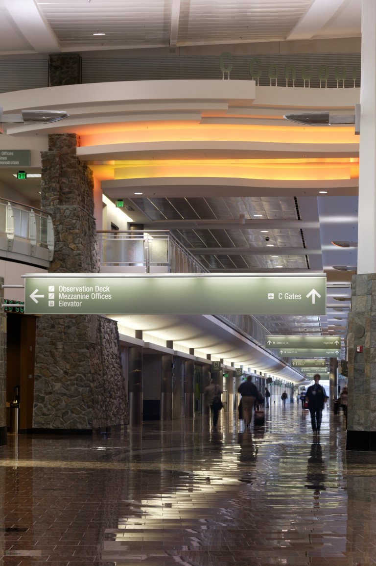 Brightly lit walkway inside airport