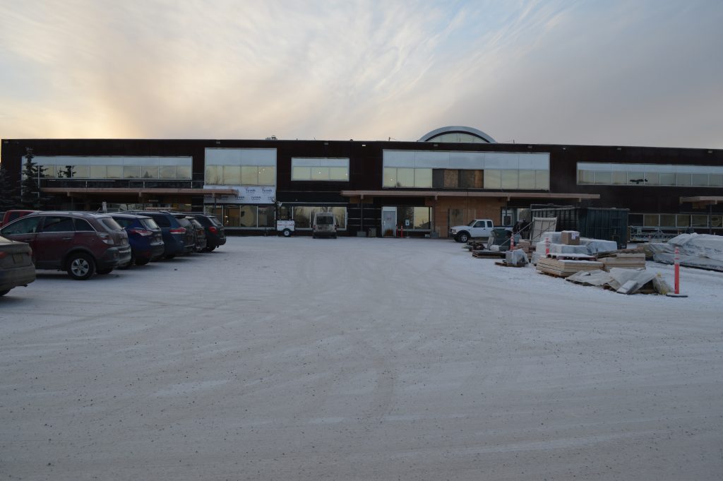 Large building under construction with no external facade