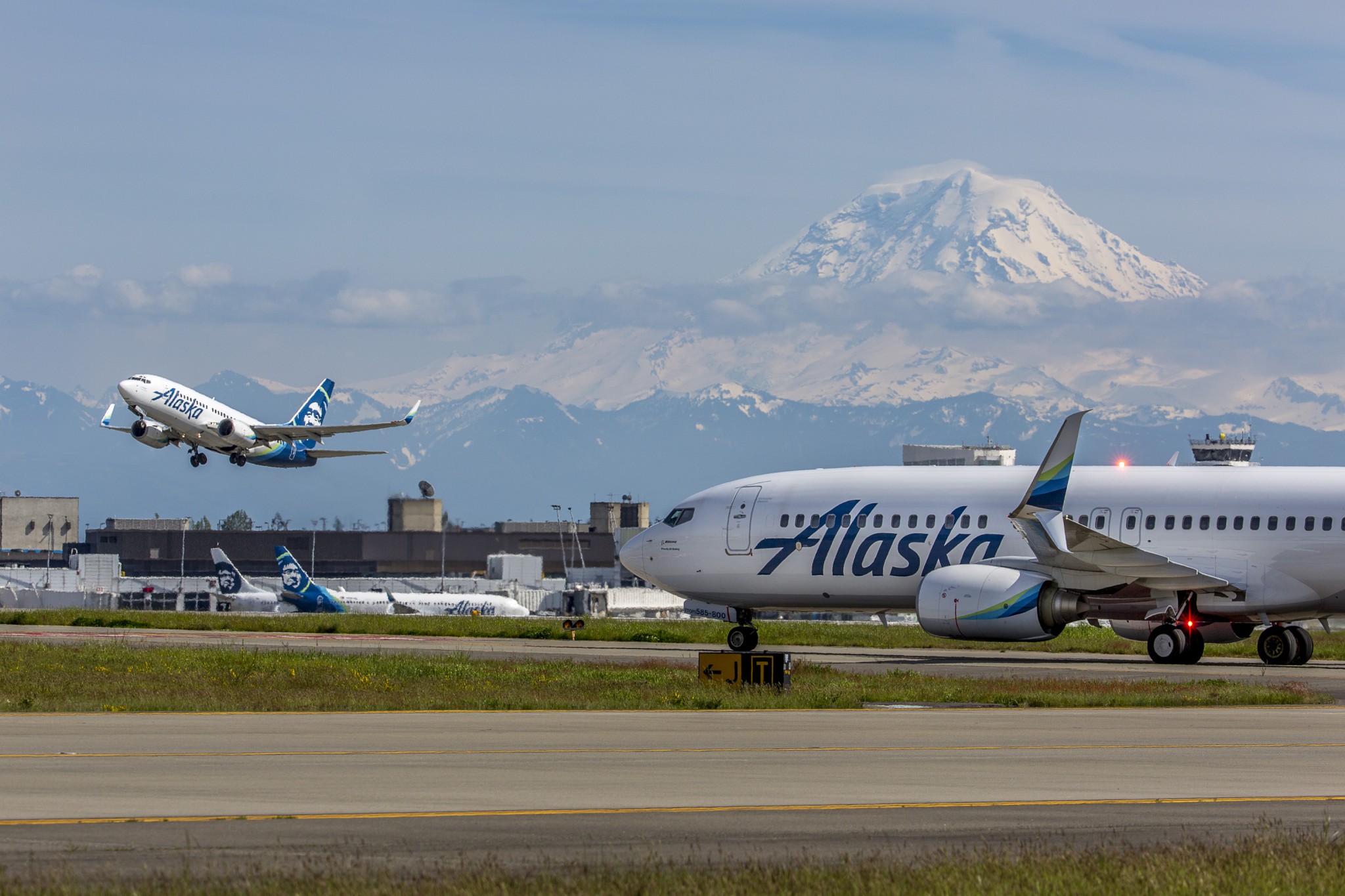 Airplanes taking off from runway