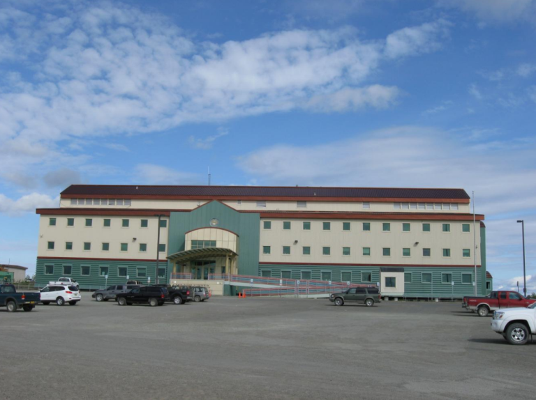 Green and tan multistory building