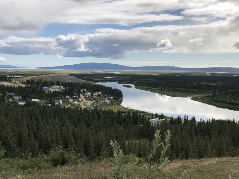 Overhead view of wooded terrain and buildings