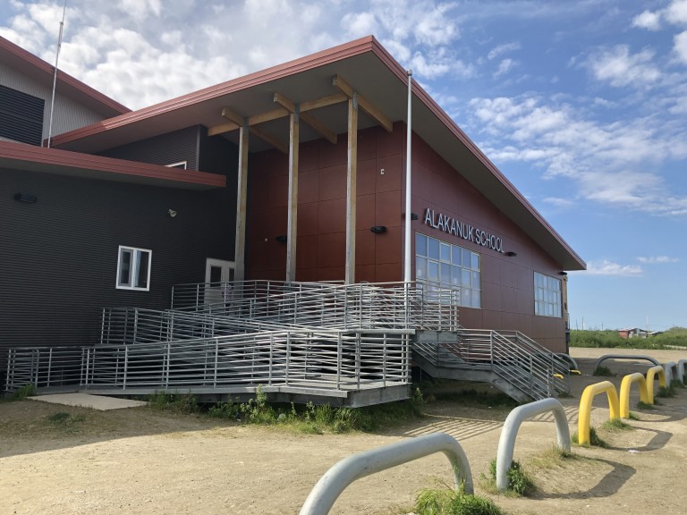 Large metal ramp and staircase leading into school building